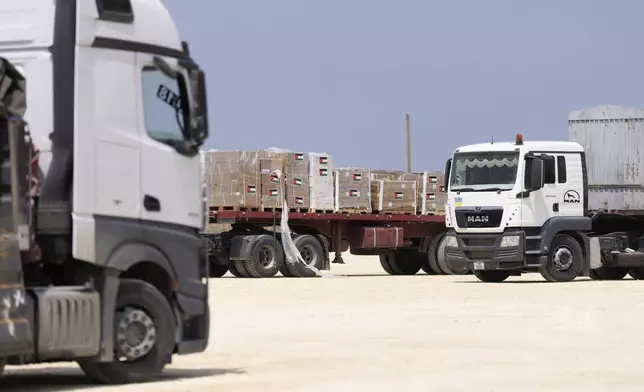 Boxes from Jordan wait an inspection area for trucks carrying humanitarian aid supplies bound for the Gaza Strip, on the Palestinian side of the Erez crossing between southern Israel and Gaza, Wednesday, May 1, 2024. (AP Photo/Ohad Zwigenberg)