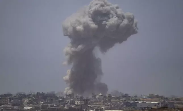 Smoke billows after an explosion in the Gaza Strip, as seen from southern Israel Tuesday, May 21, 2024. (AP Photo/Leo Correa)