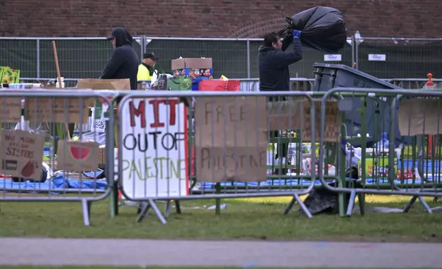 Workers dismantle the pro-Palestinian encampment at MIT, after police cleared the encampment before dawn Friday, May 10, 2024, in Cambridge, Mass. (AP Photo/Josh Reynolds)