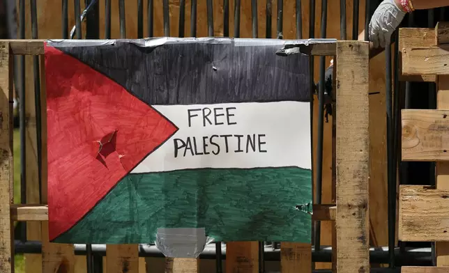 A pro Palestinians sign is shown on the UCLA campus, the morning after clashes between Pro-Israel and Pro-Palestinian groups, Wednesday, May 1, 2024, in Los Angeles. (AP Photo/Jae C. Hong)