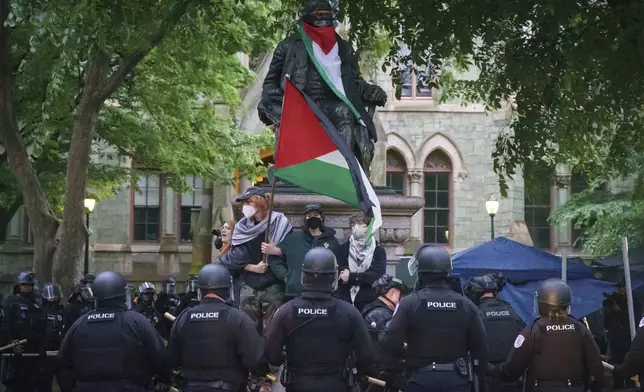 Police confront protesters at the University of Pennsylvania campus, in Philadelphia, on Friday, May 10, 2024. (Jessica Griffin/The Philadelphia Inquirer via AP)