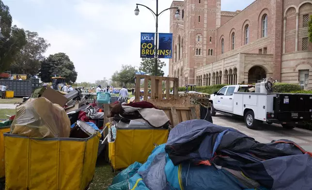 Tents and trash are left behind at the site of a pro-Palestinian encampment which was cleared by police overnight on the UCLA campus, Thursday, May 2, 2024, in Los Angeles. (AP Photo/Ashley Landis)