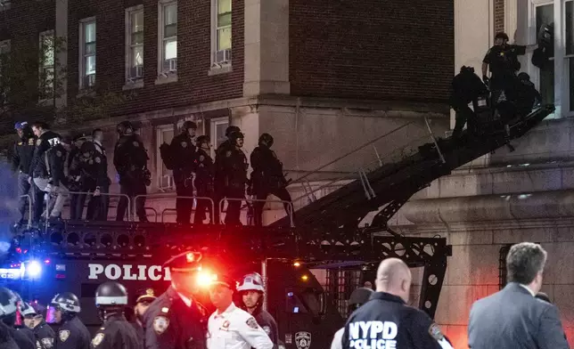 Using a tactical vehicle, New York City police enter an upper floor of Hamilton Hall on the Columbia University campus in New York Tuesday, April 30, 2024, after a building was taken over by protesters earlier Tuesday. Hundreds of police officers swept into Columbia University on Tuesday night to end a pro-Palestinian occupation of an administration building and sweep away a protest encampment, acting after the school’s president said there was no other way to ensure safety and restore order on campus.(AP Photo/Craig Ruttle)