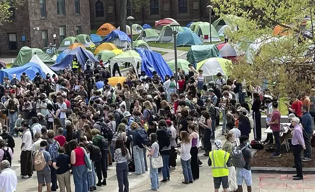 Graduate student Bataya Kline speaks at a Pro-Palestinian rally Monday, May 6, 2024 at Wesleyan University in Middletown, Conn. where a weeklong encampment has grown to more than 100 tents. Wesleyan officials have said they will allow the encampment to remain as long as the protests are peaceful and do not disrupt campus life. (AP Photo/Pat Eaton-Robb)