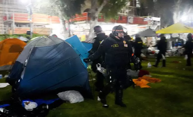 Police break up an pro-Palestinian encampment on the UCLA campus Thursday, May 2, 2024, in Los Angeles. (AP Photo/Jae C. Hong)