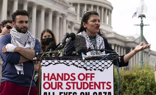 Rep. Rashida Tlaib, D-Mich., accompanied by George Washington University students speaks during a news conference at the U.S. Capitol, Wednesday, May 8, 2024, in Washington, after police cleared a pro-Palestinian tent encampment at George Washington University early Wednesday and arrested demonstrators. (AP Photo/Jose Luis Magana)