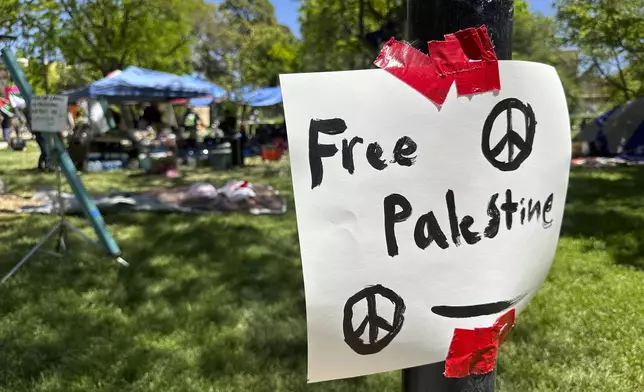Posters surround an encampment established by University of New Mexico students and supporters who are protesting the Israel-Hamas war, on the main campus in Albuquerque, N,M., on Wednesday, May 1, 2024. (AP Photo/Susan Montoya Bryan)