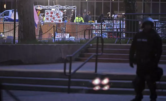 Police dismantle the pro-Palestinian encampment at MIT, before dawn Friday, May 10, 2024, in Cambridge, Mass. (AP Photo/Josh Reynolds)