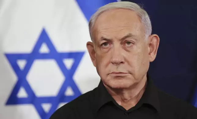 FILE - Israeli Prime Minister Benjamin Netanyahu attends a press conference in the Kirya military base in Tel Aviv, Israel on Oct. 28, 2023. Top Israeli officials are accused of seven war crimes and crimes against humanity by the ICC. (Abir Sultan/Pool Photo via AP, File)