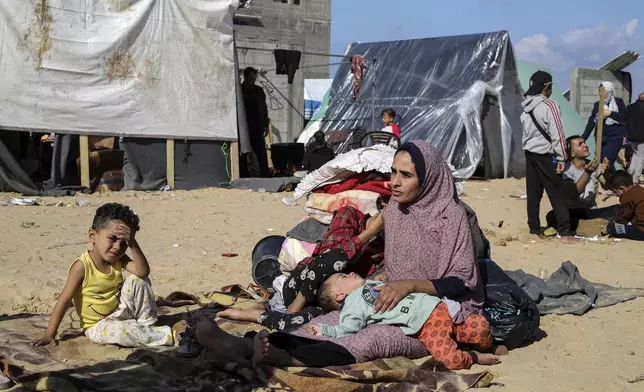 FILE - Palestinians displaced by the Israeli bombardment of the Gaza Strip set up a tent camp in Rafah on Dec. 6, 2023. The tent camps stretch for more than 16 kilometers (10 miles) along Gaza’s coast, filling the beach and sprawling into empty lots, fields and town streets. (AP Photo/Hatem Ali, file)