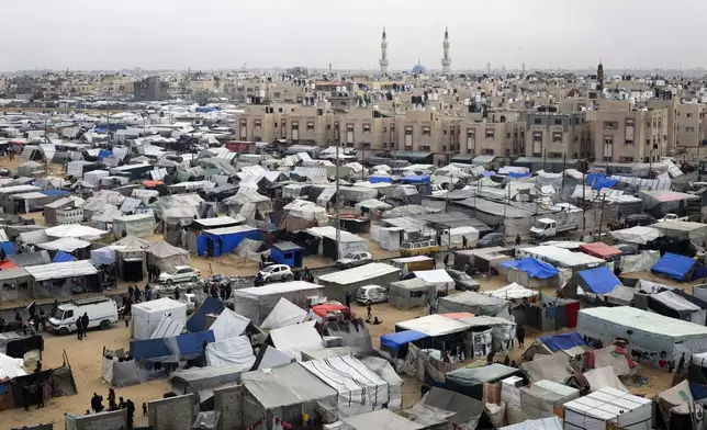 FILE - A tent camp housing Palestinians displaced by the Israeli offensive is seen in Rafah, Gaza Strip, on Feb. 27, 2024. The tent camps stretch for more than 16 kilometers (10 miles) along Gaza’s coast, filling the beach and sprawling into empty lots, fields and town streets. (AP Photo/Hatem Ali, file)