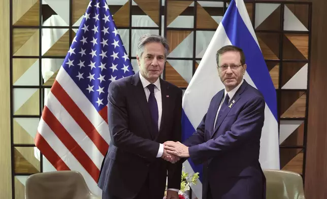 U.S. Secretary of State Antony Blinken, left, and Israeli President Isaac Herzog meet in Tel Aviv, Israel, Wednesday, May 1, 2024. (Abir Sultan/Pool Photo via AP)