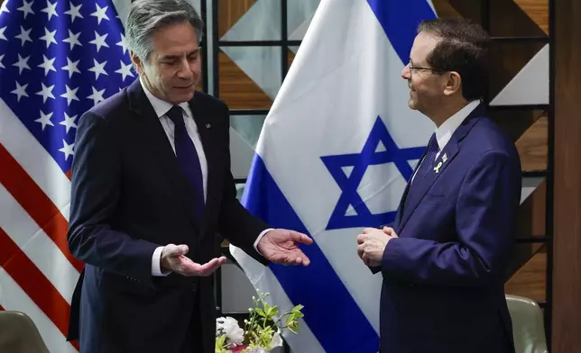 U.S. Secretary of State Antony Blinken, left, meets with Israeli President Isaac Herzog in Tel Aviv, Israel Wednesday, May 1, 2024. (Evelyn Hockstein/Pool Photo via AP)
