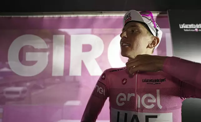 Tadej Pogačar wears the pink jersey of leader of the race after winning stage 2 of the Giro d'Italia from San Francesco al Campo to Santuario di Oropa, Italy, Sunday, May 5, 2024. (Massimo Paolone/LaPresse via AP)