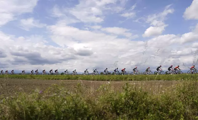 The pack rides during stage 2 of the Giro d'Italia from San Francesco al Campo to Santuario di Oropa, Italy, Sunday, May 5, 2024. (Fabio Ferrari/LaPresse via AP)