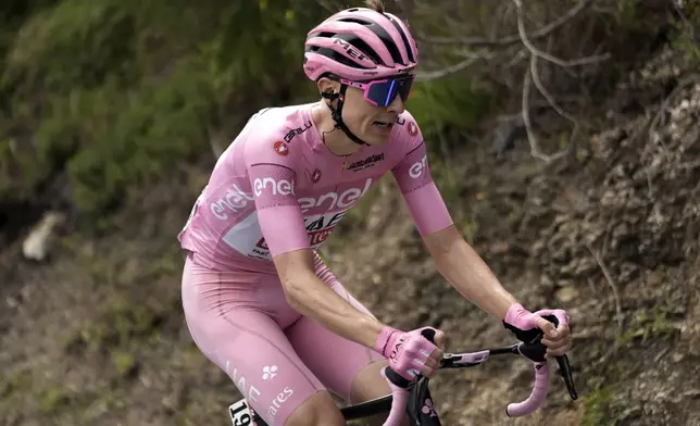 Slovenia's Tadej Pogacar, wearing the pink jersey of the race overall leader, pedals during the fifth stage of the of the Giro d'Italia, Tour of Italy cycling race, from Genoa to Lucca, Wednesday, May 8, 2024. (Fabio Ferrari/LaPresse via AP)