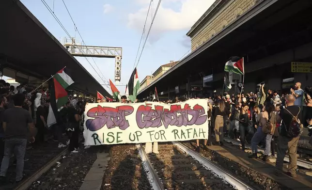 People stage a Pro-Palestinians protest at the Bologna Centrale train station in Bologna, Italy, Tuesday, May 28, 2024. (Michele Nucci/LaPresse via AP)