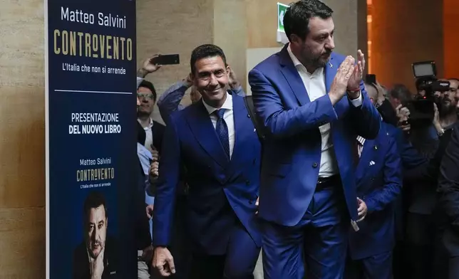 The League leader Matteo Salvini, right, arrives to his book presentation flanked by General Roberto Vannacci, one of the League candidates at the next European Parliament election, in Rome, Tuesday, April 30, 2024. (AP Photo/Alessandra Tarantino)