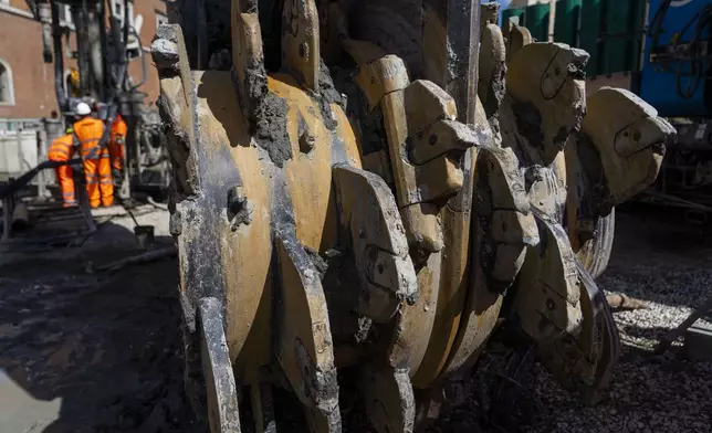 A giant hydro-milling machine rests inside the construction site of the new 25.5-kilometer Metro C subway main hub in Piazza Venezia in central Rome, Thursday, May 23, 2024. During a tour Thursday of the construction site at Piazza Venezia, chief engineer Andrea Sciotti said works on the nearly 3 billion euro project, considered one of the most complicated in the world, were running at pace to be completed by 2034. (AP Photo/Domenico Stinellis)