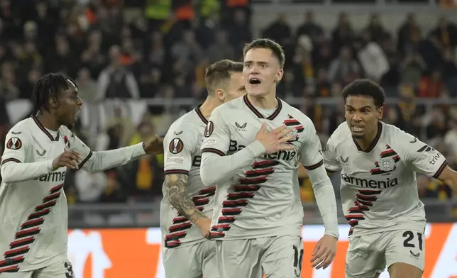 Leverkusen's Florian Wirtz celebrates after scoring their side's first goal of the game during the UEFA Europa League semifinal first leg soccer match between AS Roma and Bayer 04 Leverkusen at the Olympic stadium in Rome, Italy, Thursday, May 2, 2024. (Fabrizio Corradetti/LaPresse via AP)