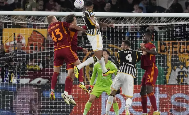 Juventus' Bremer, top, scores his side's first goal during the Serie A soccer match between Roma and Juventus, at Rome's Olympic Stadium, Sunday, May 5, 2024. (AP Photo/Andrew Medichini)