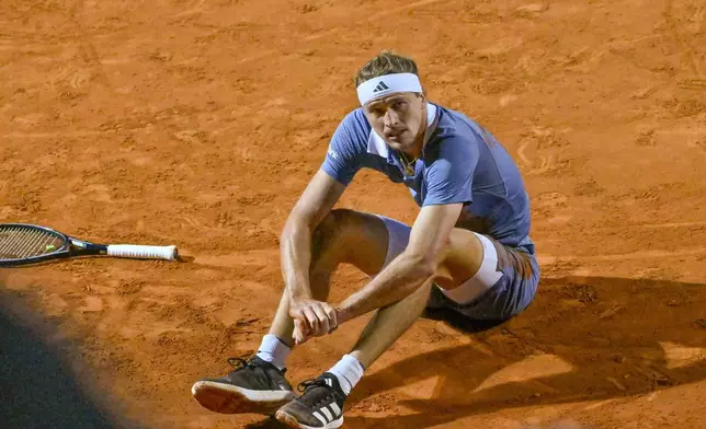 Germany's Alexander Zverev pauses after falling during his match against Taylor Fritz of the United States at the Italian Open tennis tournament at Rome's Foro Italico, Wednesday, May 15, 2024. (AP Photo/Antonietta Baldassarre)