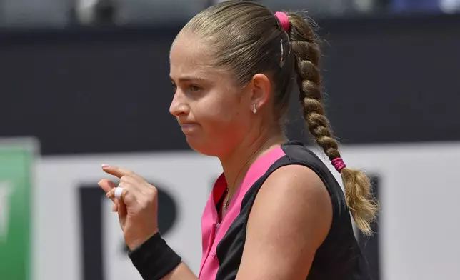 Jelena Ostapenko of Latvia gestures during a women's quarterfinal match against Belarus' Aryna Sabalenka at the Italian Open tennis tournament at Rome's Foro Italico, Wednesday, May 15, 2024. (AP Photo/Antonietta Baldassarre)