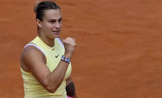 Belarus' Aryna Sabalenka celebrates after defeating Jelena Ostapenko of Latvia in the women's quarterfinal match at the Italian Open tennis tournament at Rome's Foro Italico, Wednesday, May 15, 2024. (AP Photo/Antonietta Baldassarre)