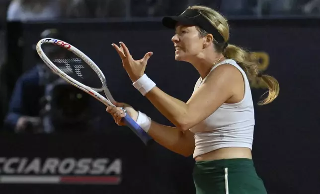 Victoria Azarenka reacts after losing a point during her match against Danielle Collins of the US at the Italian Open tennis tournament at Rome's Foro Italico, Wednesday, May 15, 2024. (AP Photo/Antonietta Baldassarre)