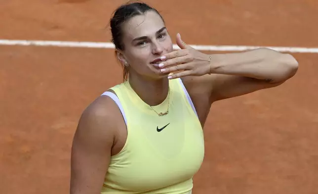 Belarus' Aryna Sabalenka celebrates after defeating Jelena Ostapenko of Latvia in the women's quarterfinal match at the Italian Open tennis tournament at Rome's Foro Italico, Wednesday, May 15, 2024. (AP Photo/Antonietta Baldassarre)