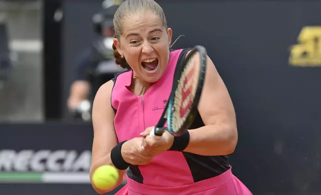 Jelena Ostapenko of Latvia return a shot against Belarus' Aryna Sabalenka during their women's quarterfinal match at the Italian Open tennis tournament at Rome's Foro Italico, Wednesday, May 15, 2024. (AP Photo/Antonietta Baldassarre)