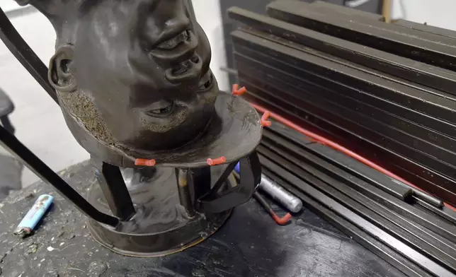 A wax mold of Jackie Robinson's head sits on a table at Art Castings of Colorado in Loveland, Colo. on Wednesday, May 8, 2024. The original statue was cut off at the ankles and stolen from a park in Wichita, Kansas in January. The Colorado foundry cast that sculpture in 2019 and, luckily, still had the original plaster and rubber molds. (AP Photo/Thomas Peipert)