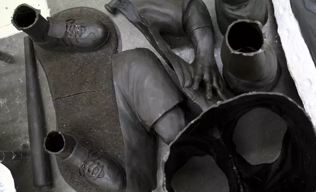 Wax molds for a Jackie Robinson sculpture are arranged on the floor at Art Castings of Colorado in Loveland, Colo. on Wednesday, May 8, 2024. The original statue was cut off at the ankles and stolen from a park in Wichita, Kansas in January. The Colorado foundry cast that sculpture in 2019 and, luckily, still had the original plaster and rubber molds. (AP Photo/Thomas Peipert)