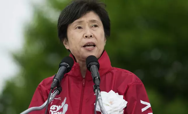 Masako Obata, president of Japan's National Confederation of Trade Unions, also known as Zenroren, speaks during a May Day rally in Tokyo, Wednesday, May 1, 2024. (AP Photo/Hiro Komae)