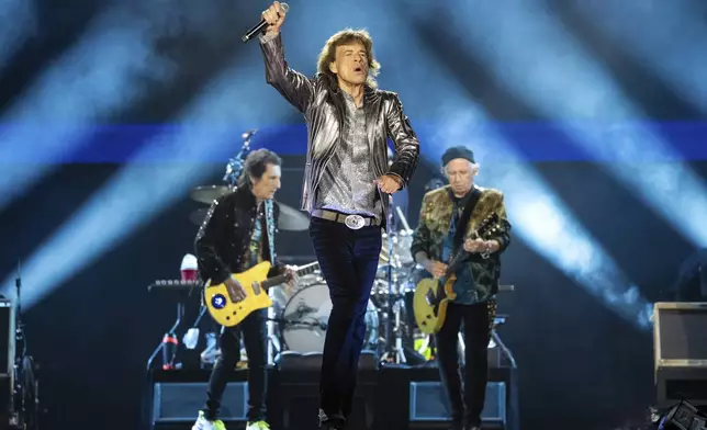 FILE - Mick Jagger of The Rolling Stones performs during the first night of the U.S. leg of their "Hackney Diamonds" tour on Sunday, April 28, 2024, in Houston. The New Orleans Jazz &amp; Heritage Festival is usually akin to a 14-ring musical circus, but that changes Thursday afternoon, May 2, when 13 stages go silent before The Rolling Stones make their first appearance at the 54-year-old festival. (Photo by Amy Harris/Invision/AP, File)