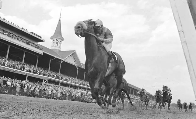 FILE - In this May 4, 1968, file photo, Dancer's Image, jockey Bob Ussery up, crosses the finish line to win the 94th running of the Kentucky Derby at Churchill Downs in Louisville, Ky. America’s longest continuously held sporting event turns 150 years old Saturday. The Kentucky Derby has survived two world wars, the Depression and pandemics, including COVID-19 in 2020, when it ran in virtual silence without the usual crowd of 150,000. (AP Photo/File)