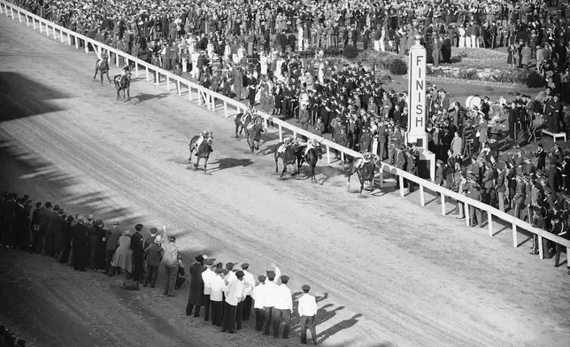 FILE - Gallahadion, with Bimelech second and Dit a close third crosses the finish line to win the 66th Kentucky Derby horse race, May 4, 1940 at Churchill Downs, Louisville, Ky. The Derby has survived two world wars, the Great Depression, and pandemics, including COVID-19 in 2020, when it ran in virtual silence without the usual crowd of 150,000. (AP Photo/FIle)