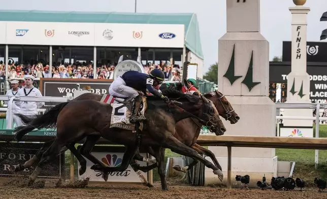 Sierra Leone, with jockey Tyler Gaffalione, (2), Forever Young, with jockey Ryusei Sakai, and Mystik, with jockey Dan Brian Hernandez Jr., cross finish line at Churchill Downs during the 150th running of the Kentucky Derby horse race Saturday, May 4, 2024, in Louisville, Ky. (AP Photo/Kiichiro Sato)