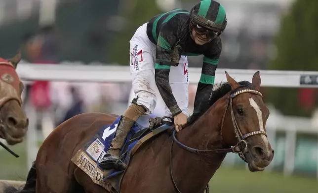 Brian Hernandez Jr. celebrates after riding Mystik Dan to win the 150th running of the Kentucky Derby horse race at Churchill Downs Saturday, May 4, 2024, in Louisville, Ky. (AP Photo/Brynn Anderson)