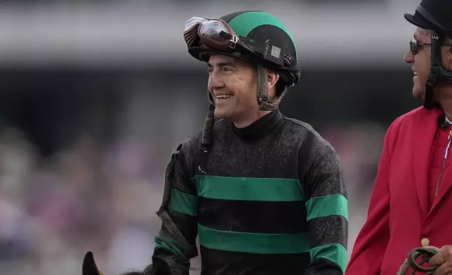 Dan Brian Hernandez Jr., celebrates after riding Mystik Dan too win the 150th running of the Kentucky Derby horse race at Churchill Downs Saturday, May 4, 2024, in Louisville, Ky. (AP Photo/Brynn Anderson)