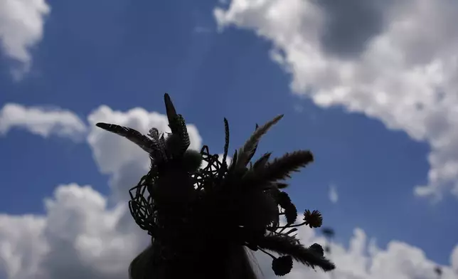 A race fan walks through the stands at Churchill Downs before the 150th running of the Kentucky Derby horse race Saturday, May 4, 2024, in Louisville, Ky. (AP Photo/Brynn Anderson)