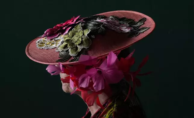 A race fan walks through the stands at Churchill Downs before the 150th running of the Kentucky Derby horse race Saturday, May 4, 2024, in Louisville, Ky. (AP Photo/Brynn Anderson)