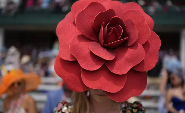 A race fan walks though the stands at Churchill Downs before the 150th running of the Kentucky Derby horse race Saturday, May 4, 2024, in Louisville, Ky. (AP Photo/Brynn Anderson)