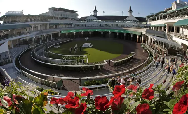 Visitors check out the new $200 million paddock at Churchill Downs Wednesday, May 1, 2024, in Louisville, Ky. The 150th running of the Kentucky Derby is scheduled for Saturday, May 4. (AP Photo/Charlie Riedel)