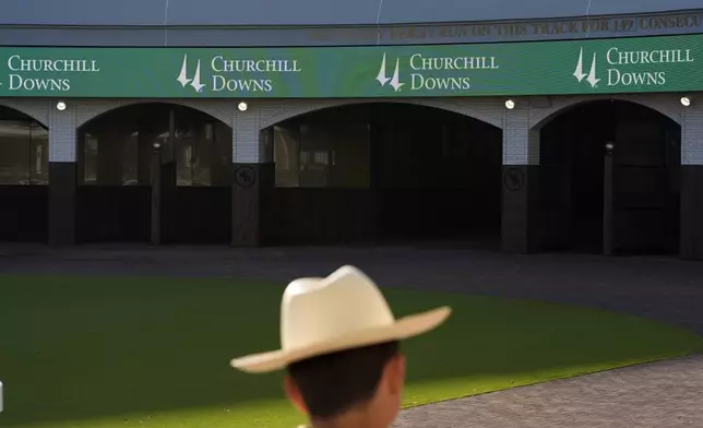A man views the new $200 million paddock at Churchill Downs Wednesday, May 1, 2024, in Louisville, Ky. The 150th running of the Kentucky Derby is scheduled for Saturday, May 4. (AP Photo/Charlie Riedel)