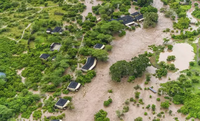A lodge is seen submerged in this aerial view of the flooded Maasai Mara National Reserve, which left dozens of tourists stranded in Narok County, Kenya, Wednesday, May 1, 2024. Kenya, along with other parts of East Africa, has been overwhelmed by flooding. (AP Photo/Bobby Neptune)