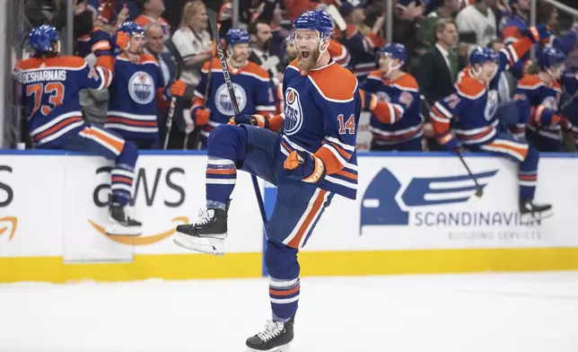 Edmonton Oilers' Mattias Ekholm (14) celebrates the win over the Los Angeles Kings in Game 5 of an NHL hockey Stanley Cup first-round playoff series, on Wednesday May 1, 2024, in Edmonton, Alberta. (Jason Franson/The Canadian Press via AP)