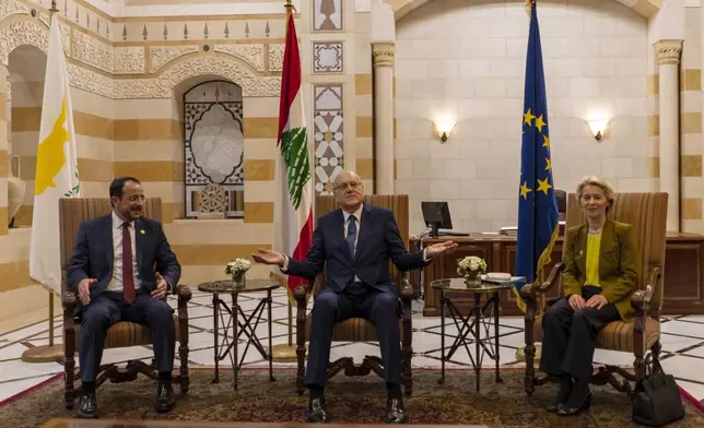 Lebanese caretaker Prime Minister Najib Mikati, center, welcomes Cyprus' president Nikos Christodoulides, left, and President of the European Commission Ursula von der Leyen before their meeting at the government palace in Beirut, Lebanon, Thursday, May 2, 2024. (AP Photo/Hassan Ammar)