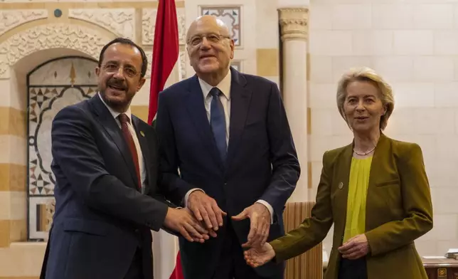 Lebanese caretaker Prime Minister Najib Mikati, center, Cyprus' President Nikos Christodoulides, left, and President of the European Commission Ursula von der Leyen pose for photograph at the government palace in Beirut, Lebanon, Thursday, May 2, 2024. (AP Photo/Hassan Ammar)