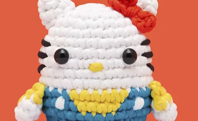 This product image released by The Woobles/The Toy Insider shows a crochet craft project featuring Sanrio’s Hello Kitty character. (The Woobles/The Toy Insider via AP)